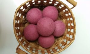 Cute Dryer Balls eliminate static cling and make a statement. Naturally scent your laundry with essential oils. These are the best dryer balls if you want to make a statement. They come in colors and different patterns. make laundry more fun! DIY dryer balls were a flop for me - you don't need to learn how to make dryer balls. Cute dryer balls are just a click away. @naturalsoapmom.com #dryerballs #staticcling #dryersheets #laundrytips #naturalhome #naturallaundryroom