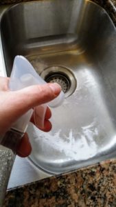 Tired of a dirty looking sink? Learn how to make your own DIY kitchen sink cleaner for your stainless steel sink or white porcelain sink. These cleaning tips using baking soda, lemon, and essential oils make quick work of stuck on messes. Learn how to clean a stainless steel sink with your own homemade sink cleaning scrub. Click to get your sink cleaning hacks and get a clean sink again! @naturalsoapmom.com #sinkcleaner #kitchencleaning #kitchencleaningkits #kitchencleaner #sinkscrub #kitchensinkclean #cleankitchen #cleankitchenatnight #cleankitchens #sinkcleaning #cleankitchens #dirtysink #dirtysinks #stainedsink #allnatural #sanitize