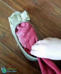 Got stinky shoes? Learn how to banish stinky shoes and feet for good with an all natural stinky shoes remedy. Choose from 3 all natural stinky shoes remedies - essential oils, baking soda, or spray. Many options to choose from. Banish boot odor too. No more stinky kids sports shoes and cleats with these 3 stinky shoes tips! @naturalsoapmom.com #stinkyshoes #myshoesstink #stinkyfeet #naturalremedies #elminatefoododor