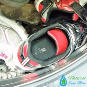 Got stinky shoes? Learn how to banish stinky shoes and feet for good with an all natural stinky shoes remedy. Choose from 3 all natural stinky shoes remedies - essential oils, baking soda, or spray. Many options to choose from. Banish boot odor too. No more stinky kids sports shoes and cleats with these 3 stinky shoes tips! @naturalsoapmom.com #stinkyshoes #myshoesstink #stinkyfeet #naturalremedies #elminatefoododor